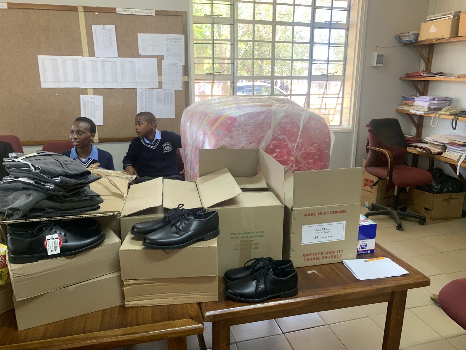 Uniforms and shoes prepared for distribution